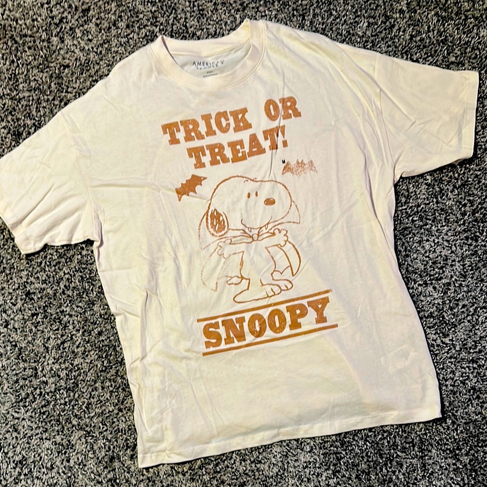 NWOT. Peanuts White and Orange Snoopy Trick or Treat Tee by American Eagle.